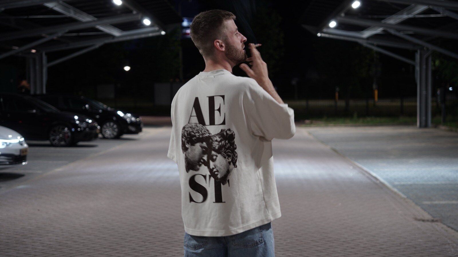 Back view branding portrait under car park lighting