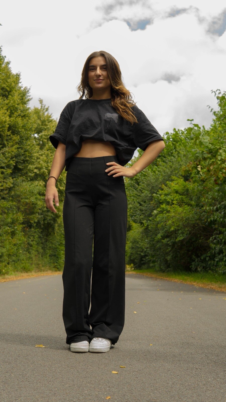 Full body fashion portrait in black outfit